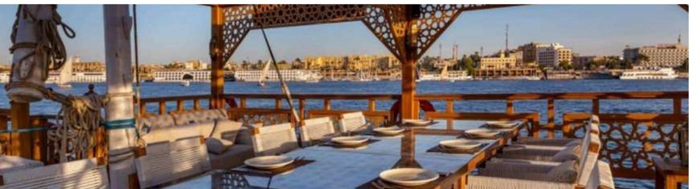 Dining table set on El Hanem's shaded sundeck