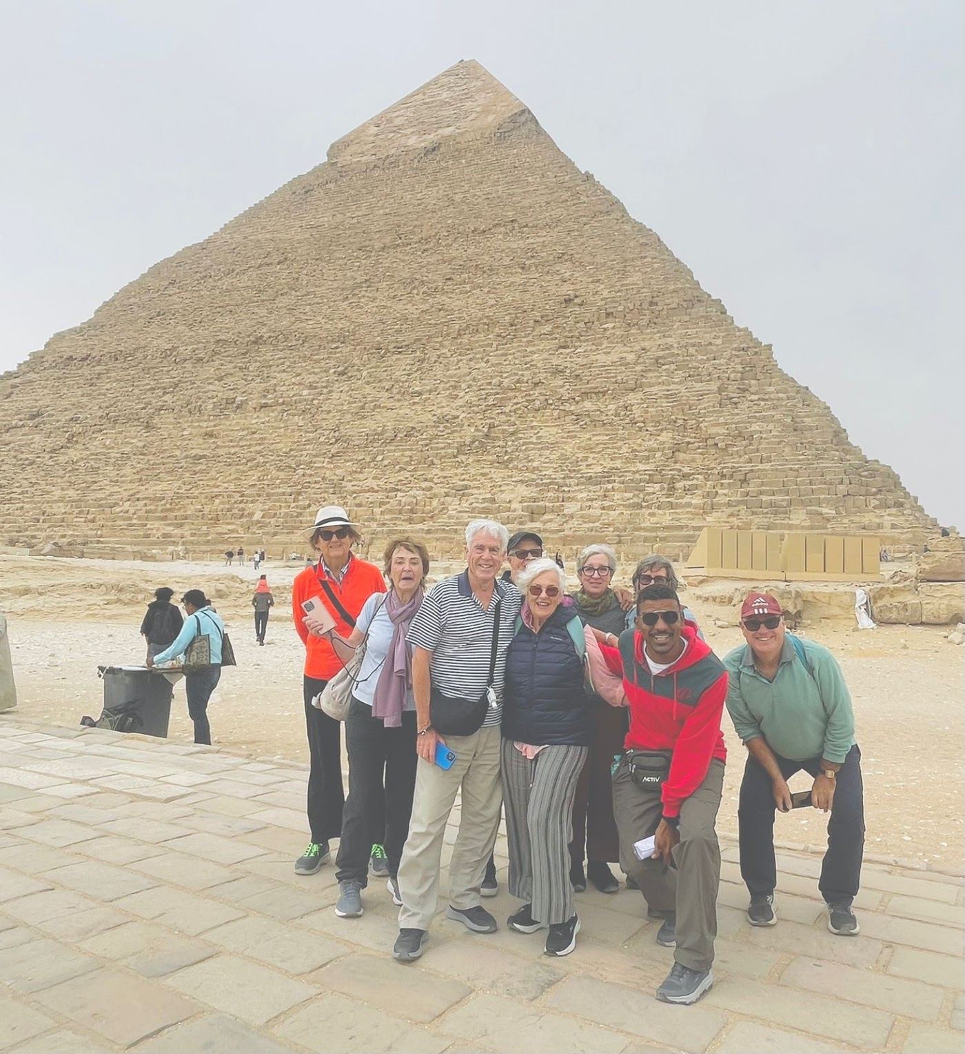 A group of Explorers at the foot of the pyramids
