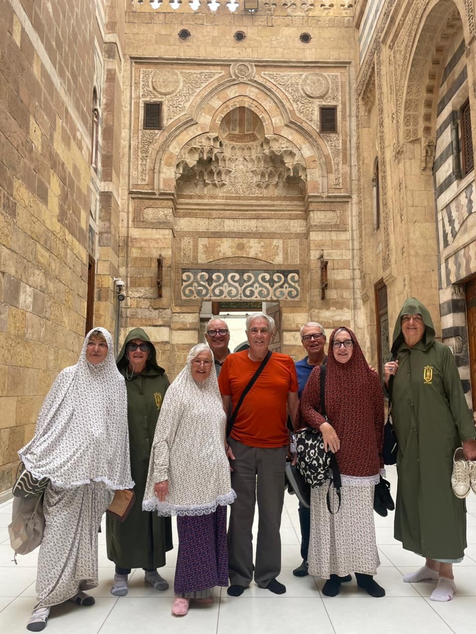 Explorers in the courtyard of a Cairo mosque